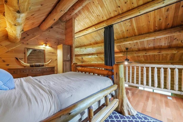 This Master Loft Bedroom allows you privacy as well as the ability to take in the beautiful surrounding views. Blackout curtains provide privacy and shade for those sunny days you want to sleep in.