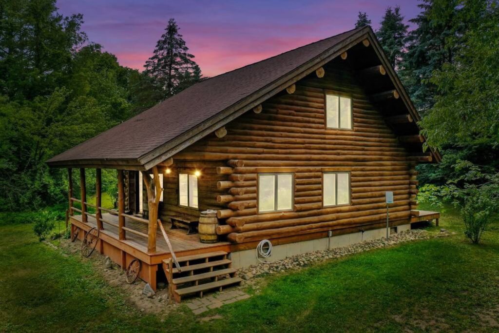 A modern, warm, and inviting log cabin with rustic aesthetics and farmhouse influences.
